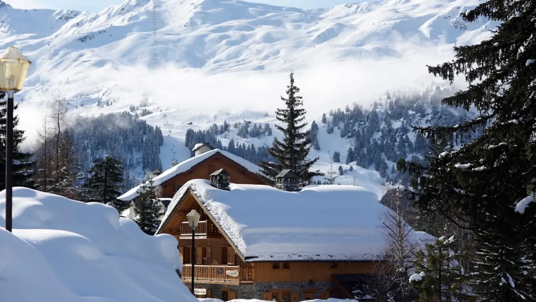 The Lodge ski in ski out chalet in Courchevel France on a sunny winter day