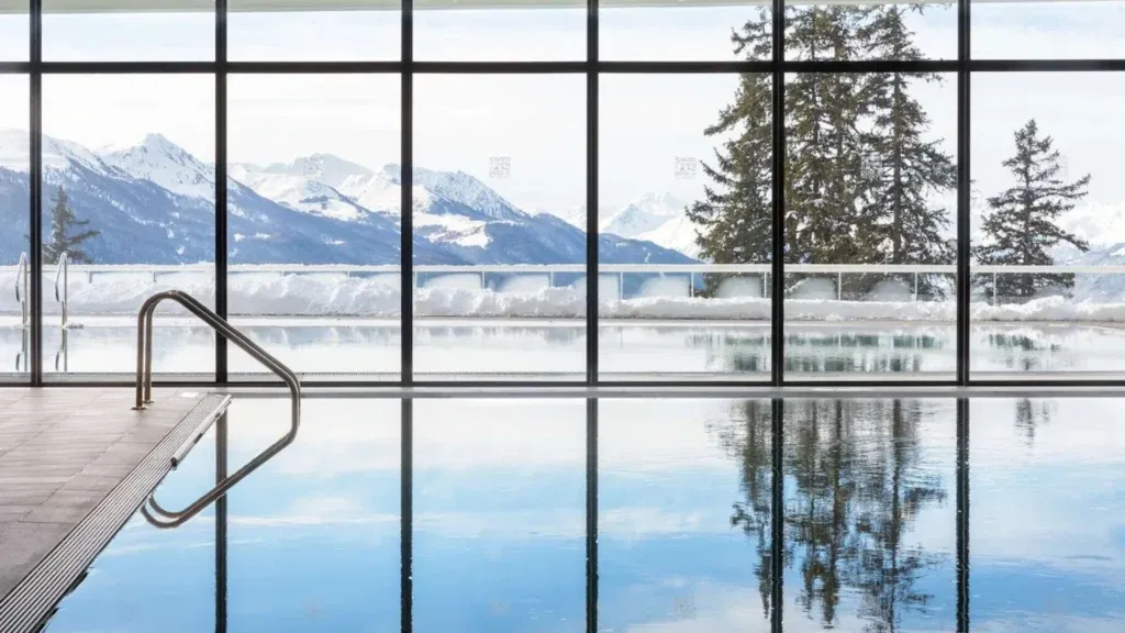 An indoor pool at a luxury ski hotel