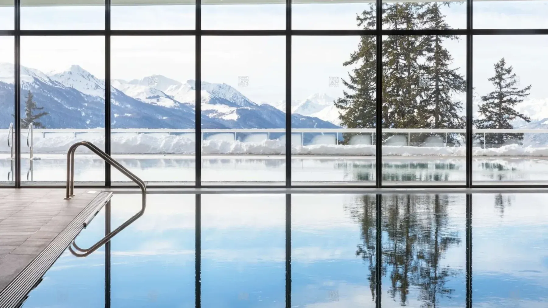 An indoor pool at a luxury ski hotel